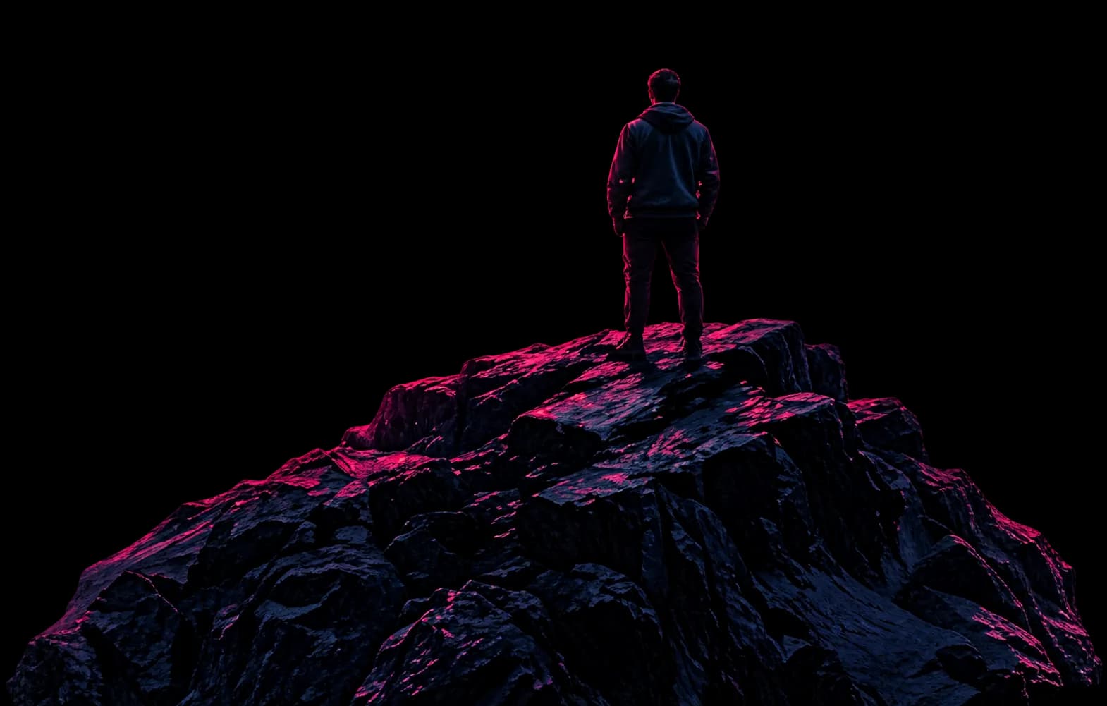 Person on Rocks Overlooking City